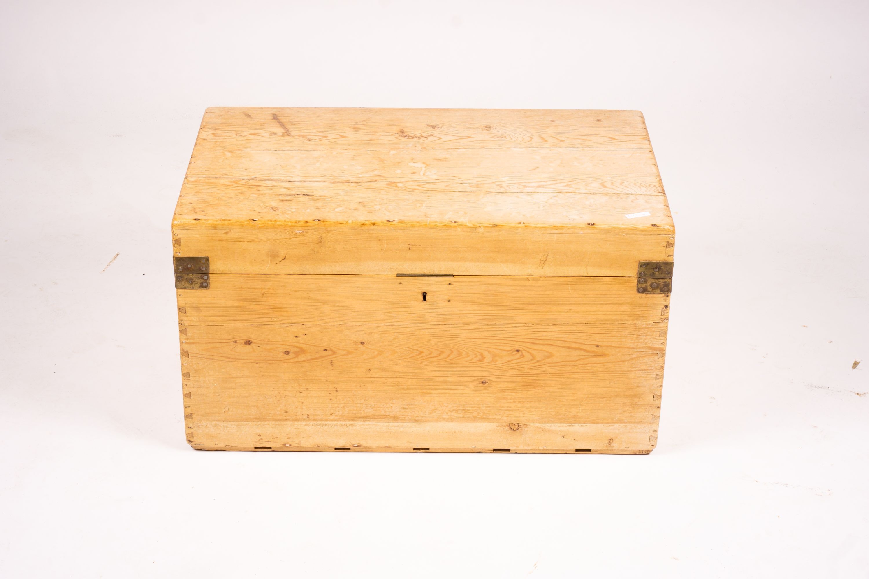 A small Victorian brass bound rectangular pine trunk, length 76cm, depth 46cm, height 42cm